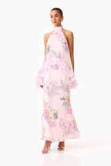 Brunette model wearing the Millie Tiered Gown in Pink Floral posed side shot 
