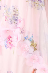 Brunette model wearing the Millie Tiered Gown in Pink Floral detail shot 
