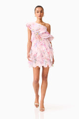 Brunette model wearing the Millie One Shoulder Mini Dress in Pink Floral posed front shot 
