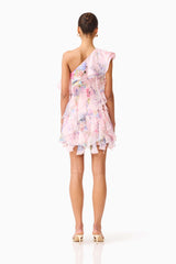 Brunette model wearing the Millie One Shoulder Mini Dress in Pink Floral back shot 
