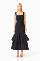 Brunette model wearing the Alexandra Tiered Gown in Black front shot 