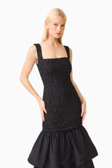 Brunette model wearing the Alexandra Tiered Gown in Black posed shot 