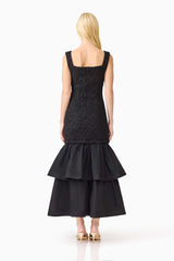 Brunette model wearing the Alexandra Tiered Gown in Black back shot 