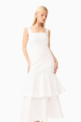Brunette model wearing the Alexandra Tiered Gown in White posed shot 
