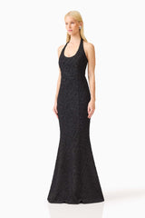 Brunette model wearing the Alexandra Halter Gown Dress in Black side shot 
