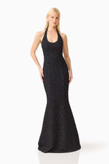Brunette model wearing the Alexandra Halter Gown Dress in Black posed front shot 
