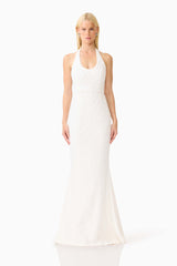 Brunette model wearing the Alexandra Halter Gown Dress in White front shot 
