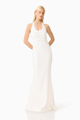 Brunette model wearing the Alexandra Halter Gown Dress in White posed front shot 
