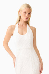 Brunette model wearing the Alexandra Halter Gown Dress in White close up shot 
