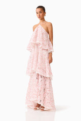 Brunette model wearing the Valencia Tiered Gown in Pink & Cream Floral side shot 
