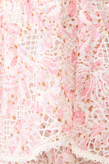 Brunette model wearing the Valencia Tiered Gown in Pink & Cream Floral detail shot 
