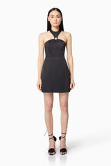 Brunette model wearing DAZZLE HALTER NECK MINI DRESS IN BLACK front shot