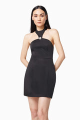 Brunette model wearing DAZZLE HALTER NECK MINI DRESS IN BLACK close up shot