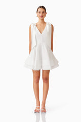 Brunette model wearing Kalani Mini Dress in White front shot