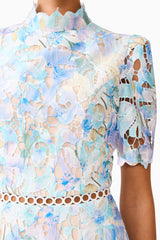 Brunette model wearing the Kalissa A-Line Mini Dress in Blue Floral detail shot 