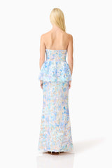 Brunette model wearing the Kalissa Strapless Gown in Blue Floral back shot