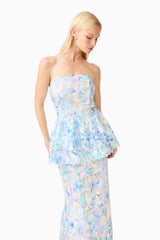 Brunette model wearing the Kalissa Strapless Gown in Blue Floral posed close up shot