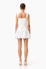 Brunette model wearing the Elizabeth A-Line Mini Dress in White back shot 
