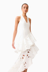 Brunette model wearing the Elizabeth Asymmetrical Gown in White side close up shot 
