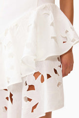 Brunette model wearing the Elizabeth Asymmetrical Gown in White detail shot 
