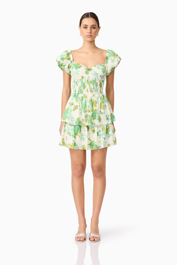 Brunette model wearing Tess Puff Sleeve Mini Dress in Green front shot