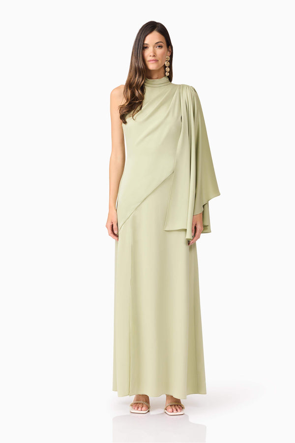 Brunette model wearing Anika Asymmetrical Maxi Dress in Green front shot