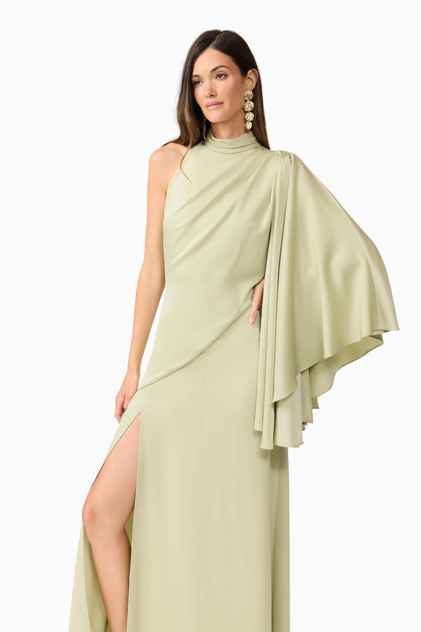 Brunette model wearing Anika Asymmetrical Maxi Dress in Green close up posed shot