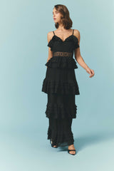 Brunette model wearing the Lucinda Tiered Gown in Black campaign shot 