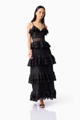 Brunette model wearing the Lucinda Tiered Gown in Black posed shot 