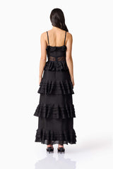 Brunette model wearing the Lucinda Tiered Gown in Black back shot 