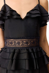 Brunette model wearing the Lucinda Tiered Gown in Black detail shot 