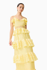 Brunette model wearing the Lucinda Tiered Gown in Lemon Yellow close up shot 