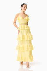 Brunette model wearing the Lucinda Tiered Gown in Lemon Yellow posed shot 