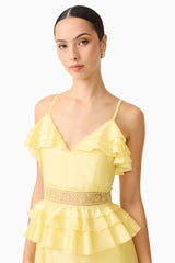 Brunette model wearing the Lucinda Tiered Gown in Lemon Yellow detail shot 