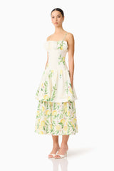Brunette model wearing the Hana Tiered Maxi Dress in Lemon Print side shot 
