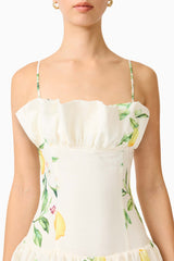 Brunette model wearing the Hana Tiered Maxi Dress in Lemon Print detail shot 