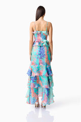 Brunette model wearing the Coral Tiered Gown in Blue Multi back shot 