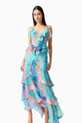 Brunette model wearing the Coral Tiered Gown in Blue Multi posed shot 