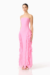 Brunette model wearing the Amelina Strapless Gown in Pink side shot 