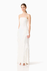 Brunette model wearing the Amelina Strapless Gown in White side shot 