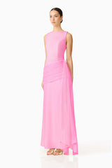Brunette model wearing the Amelina Sash Gown in Pink side shot