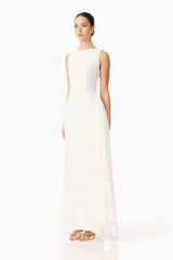 Brunette model wearing the Amelina Sash Gown in White side shot 