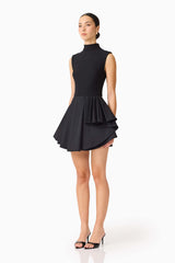 Brunette model wearing the Nydia A-Line Mini Dress in Black side shot