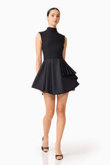 Brunette model wearing the Nydia A-Line Mini Dress in Black posed shot