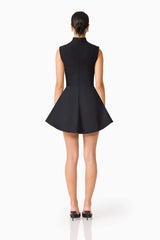 Brunette model wearing the Nydia A-Line Mini Dress in Black back shot