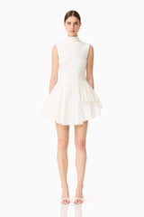 Brunette model wearing the Nydia A-Line Mini Dress in White front shot