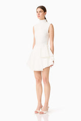 Brunette model wearing the Nydia A-Line Mini Dress in White side shot