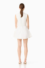 Brunette model wearing the Nydia A-Line Mini Dress in White back shot