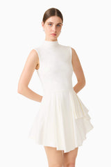 Brunette model wearing the Nydia A-Line Mini Dress in White close up shot