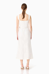 Brunette model wearing the Nydia Fit & Flare Maxi Dress in White back shot 